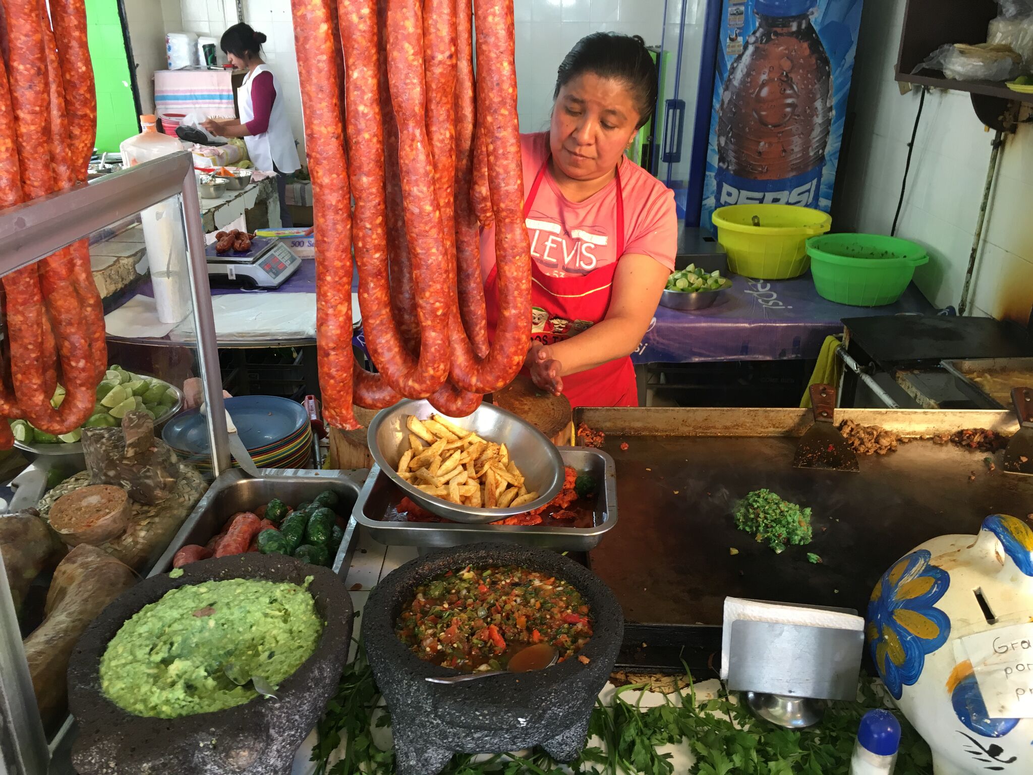 Making tacos de longaniza in Mexico City. Photo: Kiki