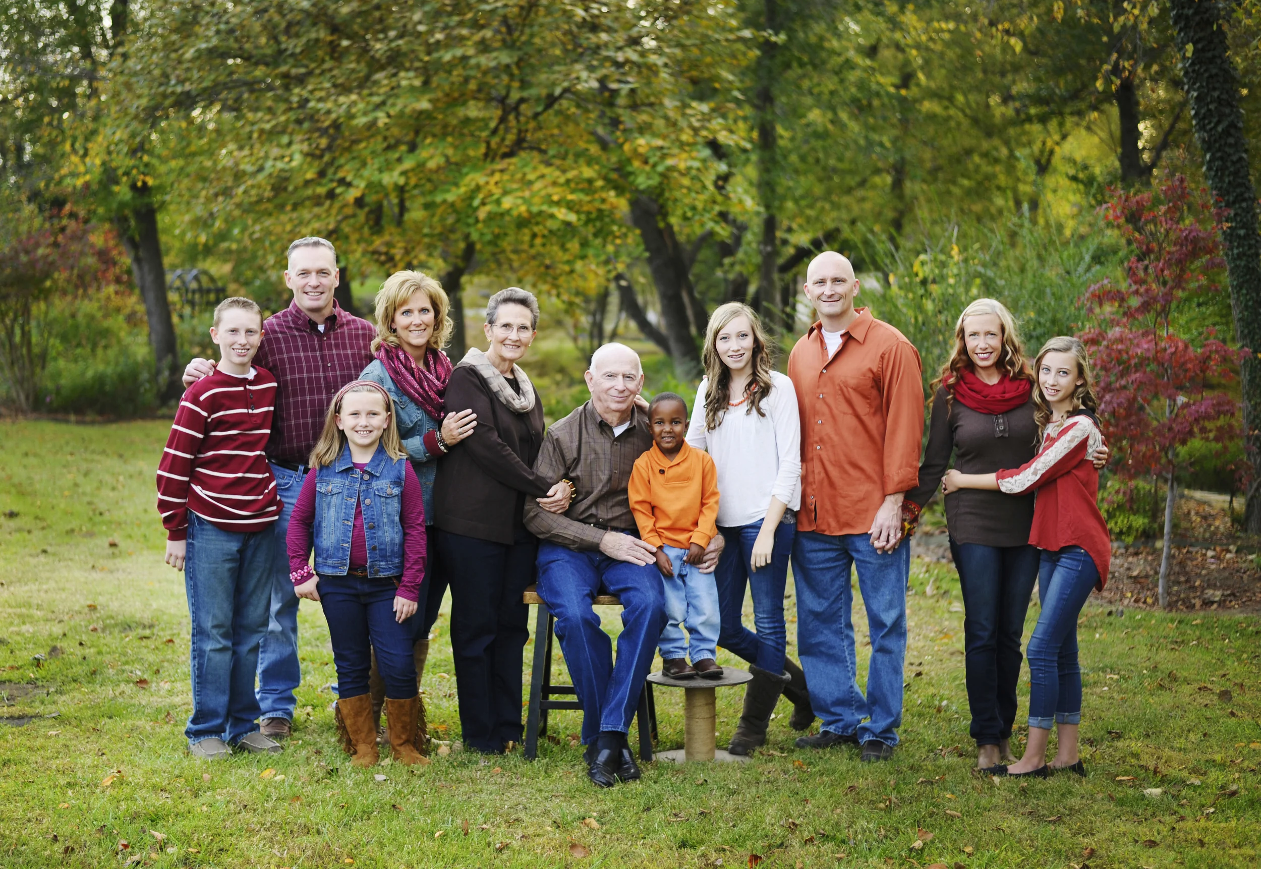 One of my most favorite things to photograph is an extended family portrait because I think they're so important. They can also be very tricky to coordinate outfits and make everyone happy. This family photographed in the fall went with some great fall colors that really work well together. They chose brown as their neutral color and orange and magenta as their accent colors. I think it all worked perfectly and wardrobe didn't distract from the most important thing in this photo which is family and oh what a sweet family it is. Good job everyone! 