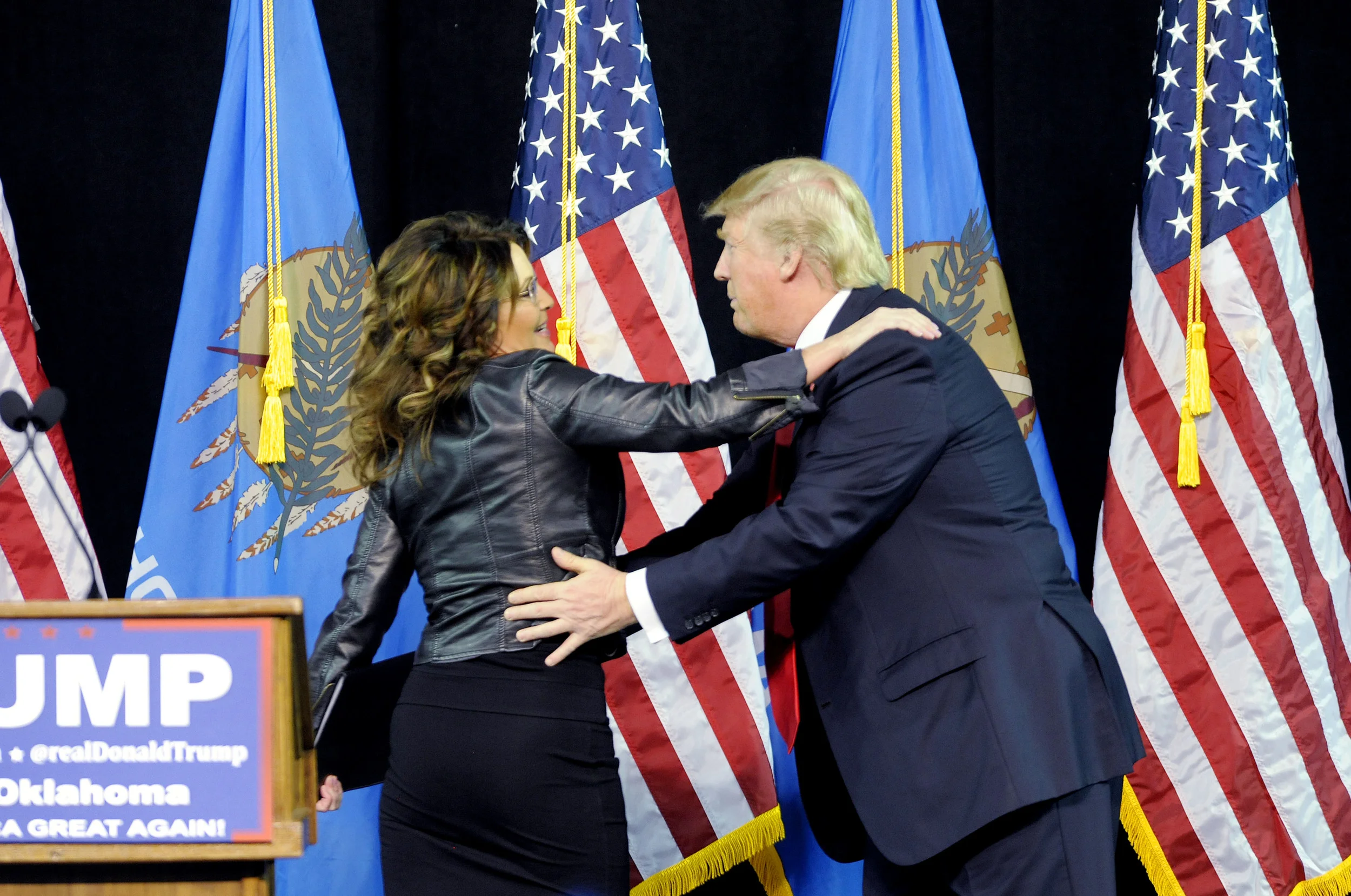 Former Republican vice presidential candidate and Alaska Governer Sarah Palin and presidential candidate Donald Trump embrace during a Trump rally held at the Mabee Center in Tulsa, Okla. Wednesday, Jan 20, 2016. Photo by Brandi Simons for The Associated Press