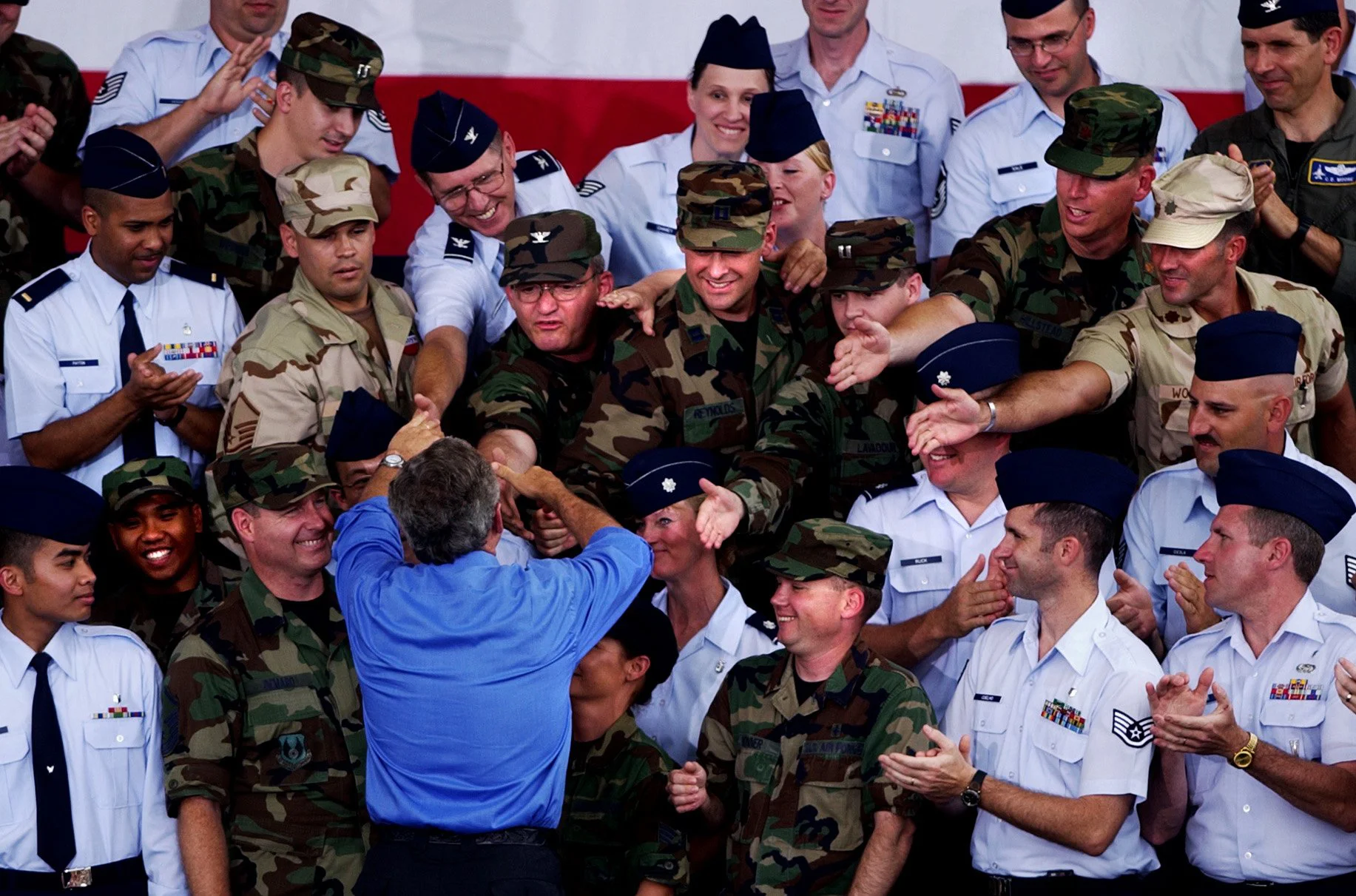 President George W. Bush shakes hands with military personnel after his speech at Wright-Patterson Air Force Base in Dayton, Ohio. July 2003 (Brandi Stafford photo)
