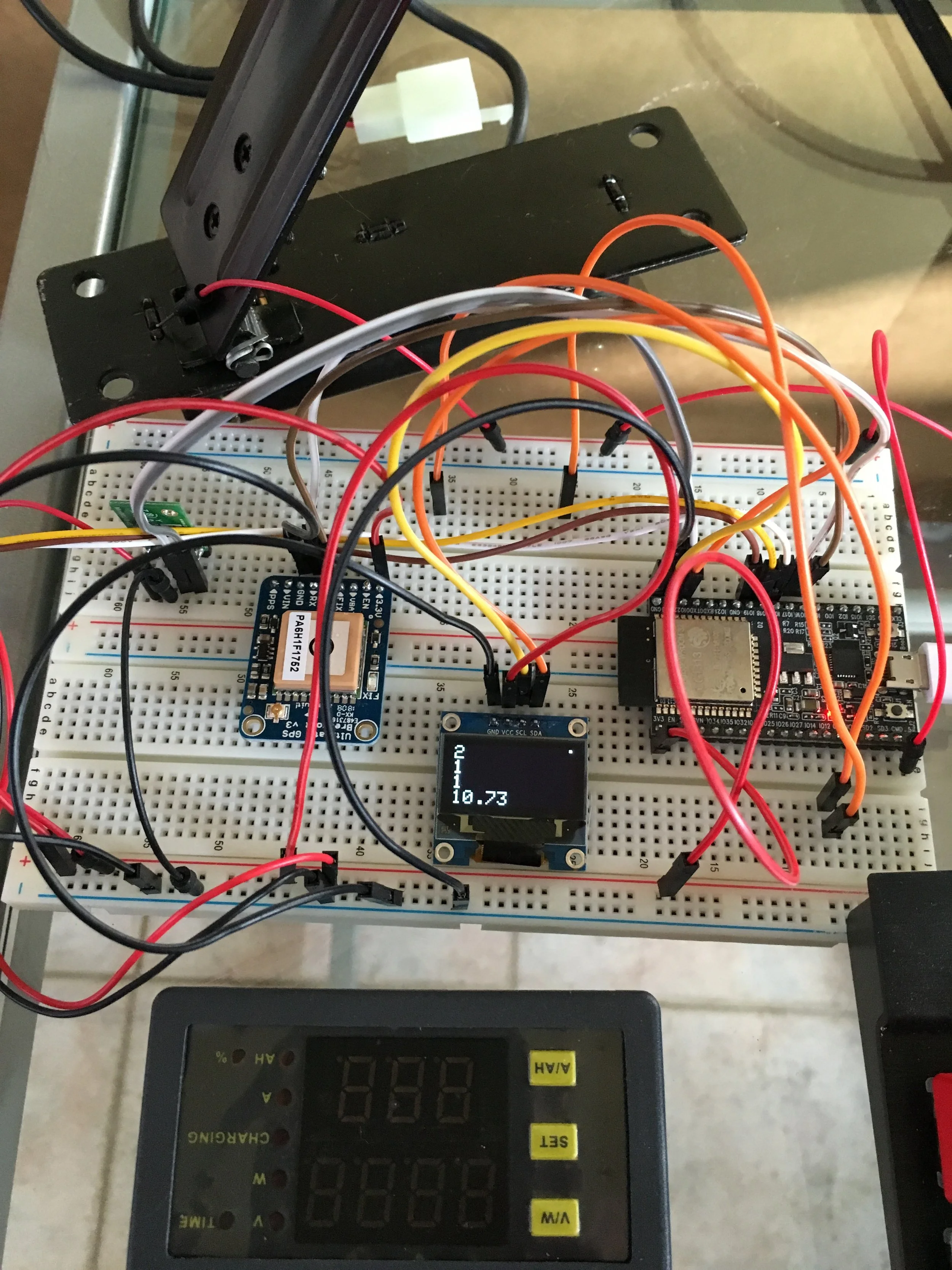 Thing are getting serious. Top left accelerometer and magnetometer to give me the G force, and a compas (for fun) brown square, gps to give me my speed (the orientation is given by the magnetometer, because gps are bad for that if you don't move or move slowly). of course on the right my esp32. bottom is my voltmeter and ammeter .