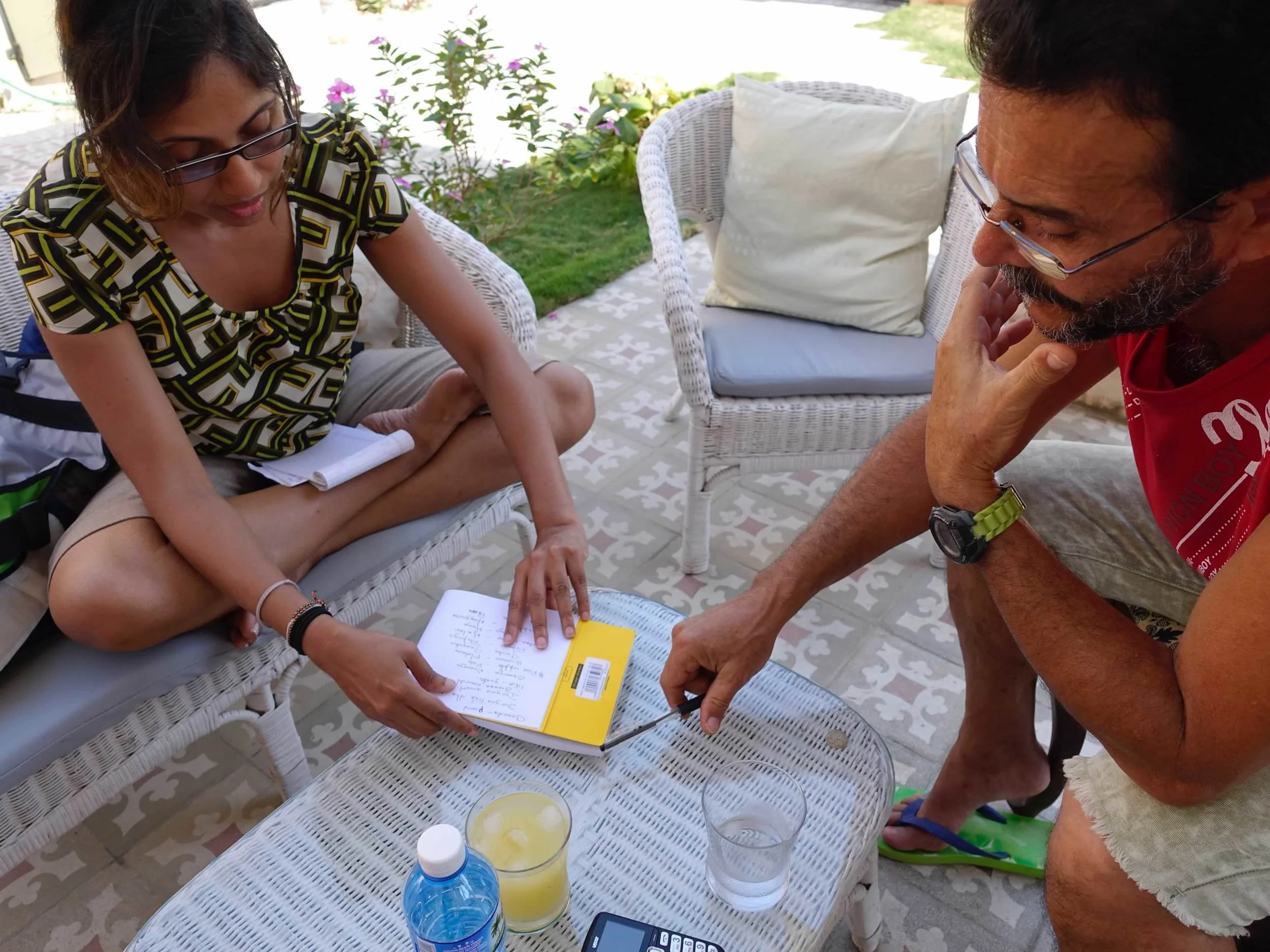 UBELONGER, Tharangi (l) works with a Cuban man, Rene to improve his English, while she polishes her Spanish skills.
