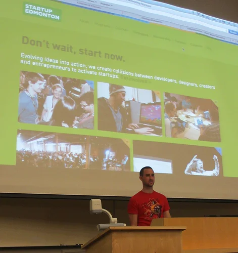 Cam Linke, Startup Edmonton Co-Founder, introducing companies at DemoCamp 19. Photo Credit: Mack Male. 