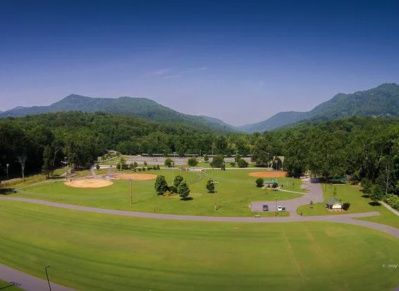 A wide shot of the Harmon Field complex, with its magnificent mountain vistas.