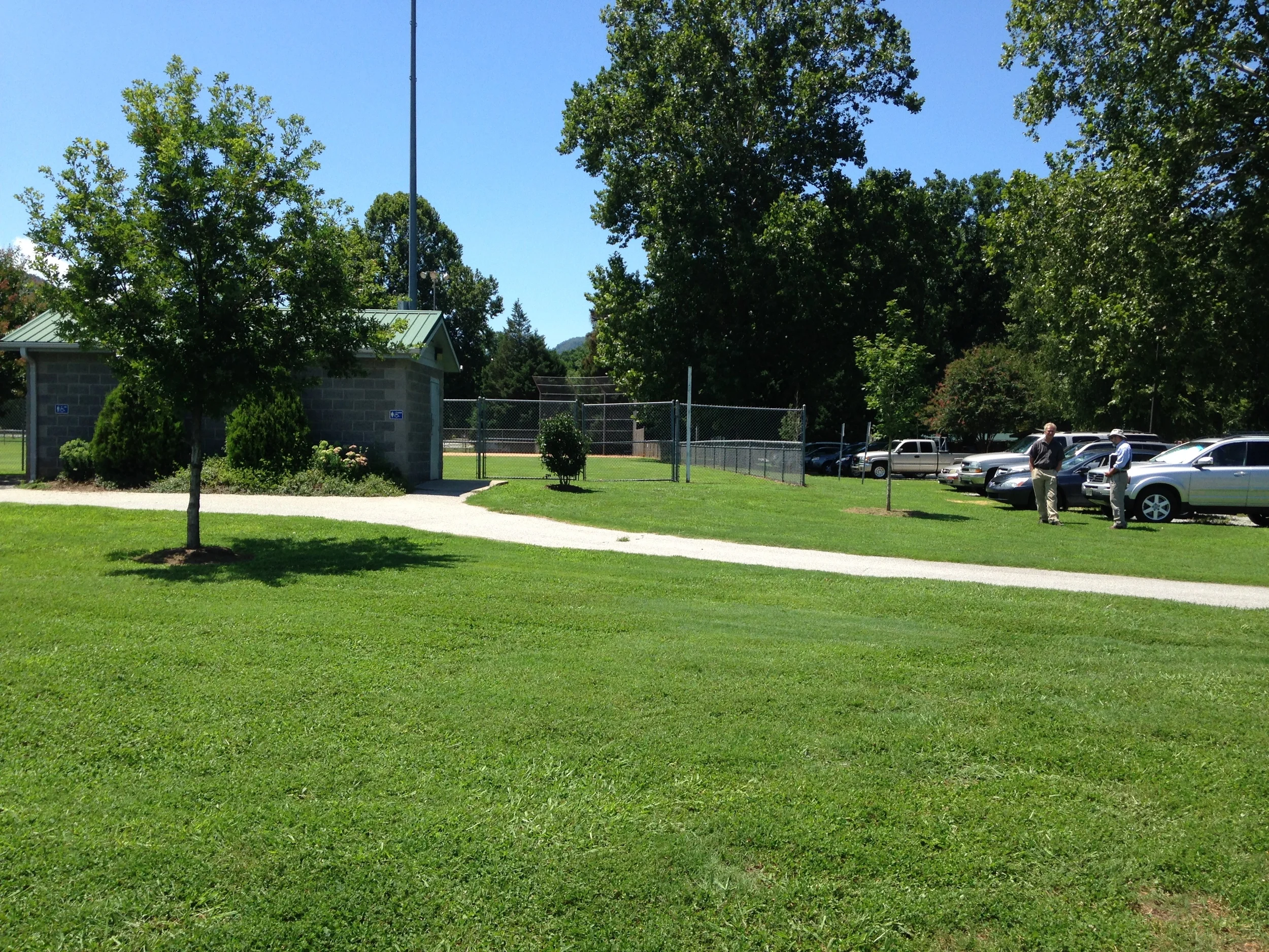 A view looking toward the rearmost baseball diamond, with parking and picnic areas to the right.