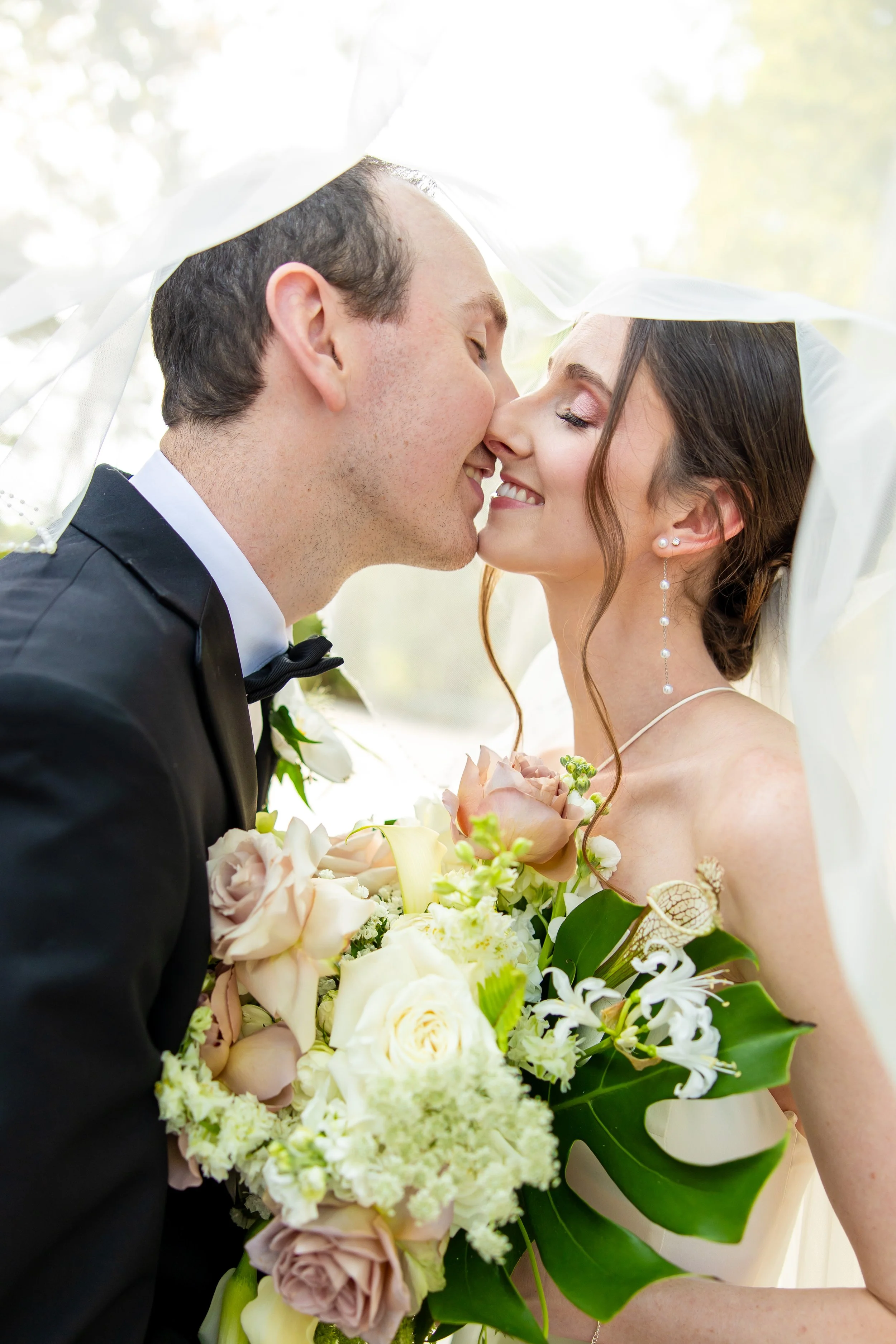 Bride Delaney wearing a romantic rose bridal makeup look and elegant updo by Paula J Fields Beauty for her Riverbanks Zoo wedding in Columbia, SC.