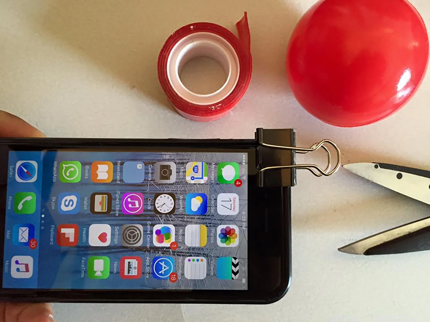 5. Place the clip above the phone where there are no obstruction to your front and back cameras.