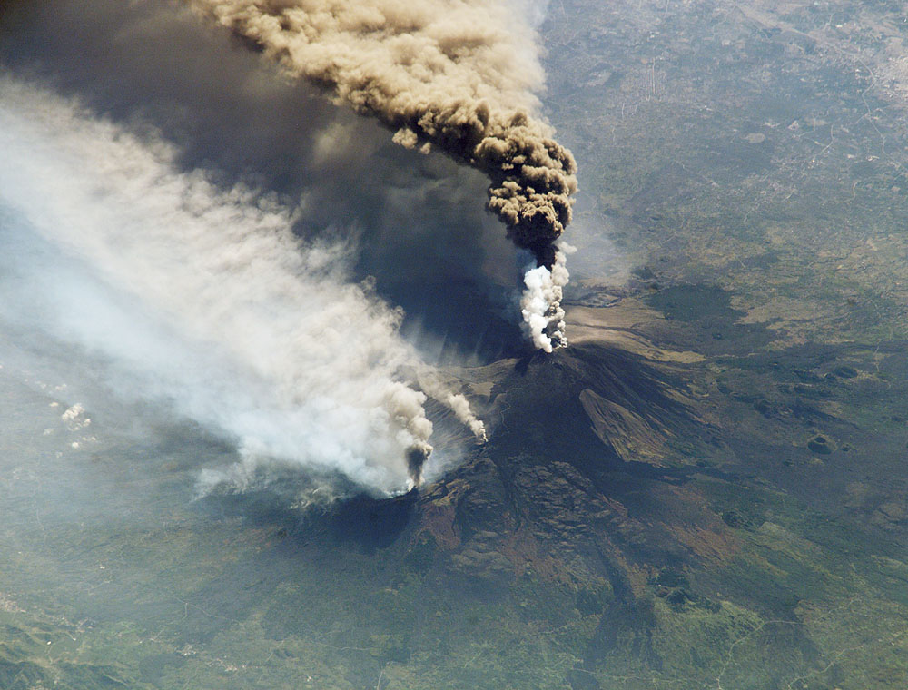 Sulfur dioxide gas is injected into the stratosphere by volcanic eruptions such as this eruption of Mt Etna. In the stratosphere, this gas forms sulfate aerosol clouds which reduce the amount of sunlight that reaches the surface of Earth. NASA Goddard Space Flight Center/Flickr (CC BY 2.0)