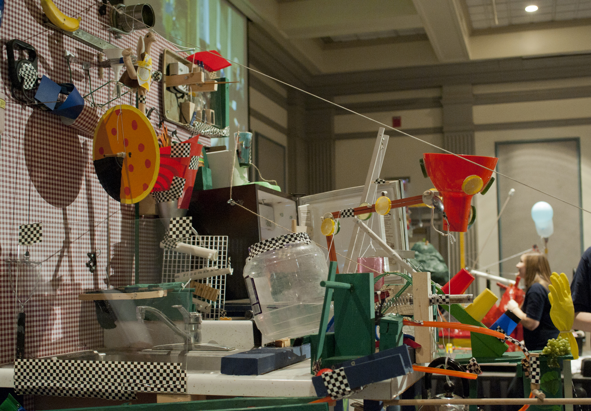 Rube Goldberg machines are intricate displays of engineering prowess, designed to achieve a goal by the transfer and transformation of energy throughout a system of levers, pulleys, domino effects, gravitational potential energy, heat transfer and so forth. Penn State/Flickr (CC BY-NC 2.0)