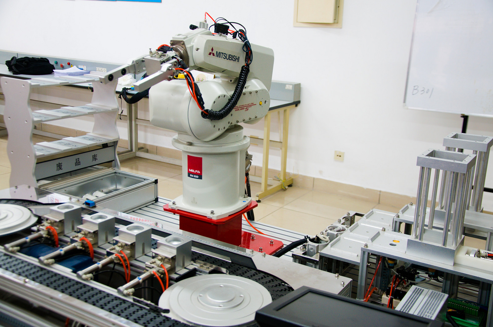 An industrial robot being trained at Tianjin College of Mechanics and Electricity in China. Mitch Altman/Flickr (CC BY-SA 2.0)