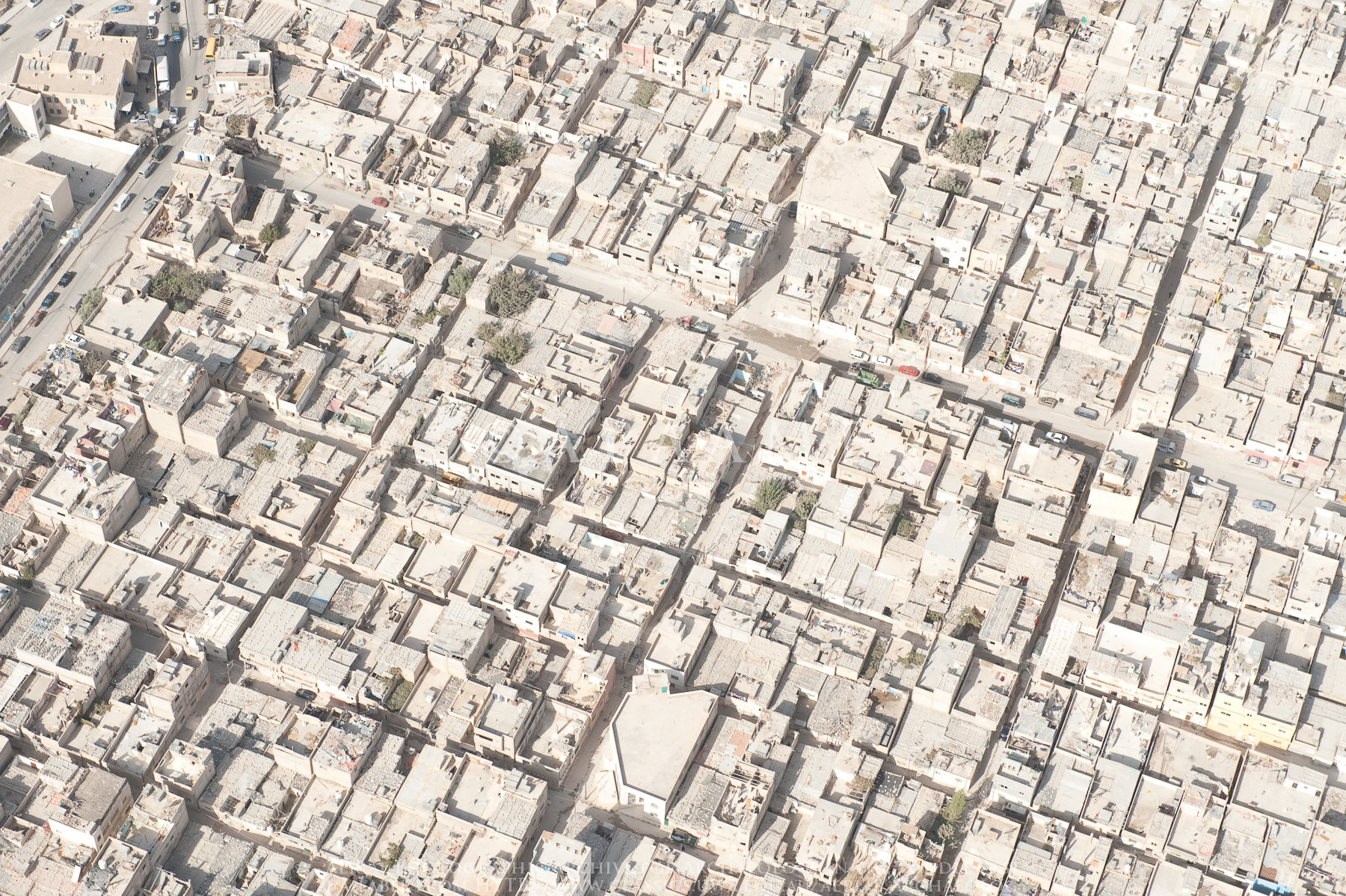 Crowded conditions in refugee camps can overburden support services and infrastructure, alongside all the problems caused by household crowding. Aerial Photographic Archives for Archaeology in the Middle East/Flickr (CC BY-NC-ND 2.0)