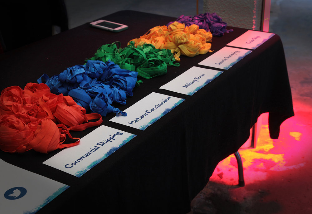 Participants chose from five coloured strings in the exhibition that represent different human activities that produce a lot of noise in the ocean. © Urban Dream Brokerage (used with permission)