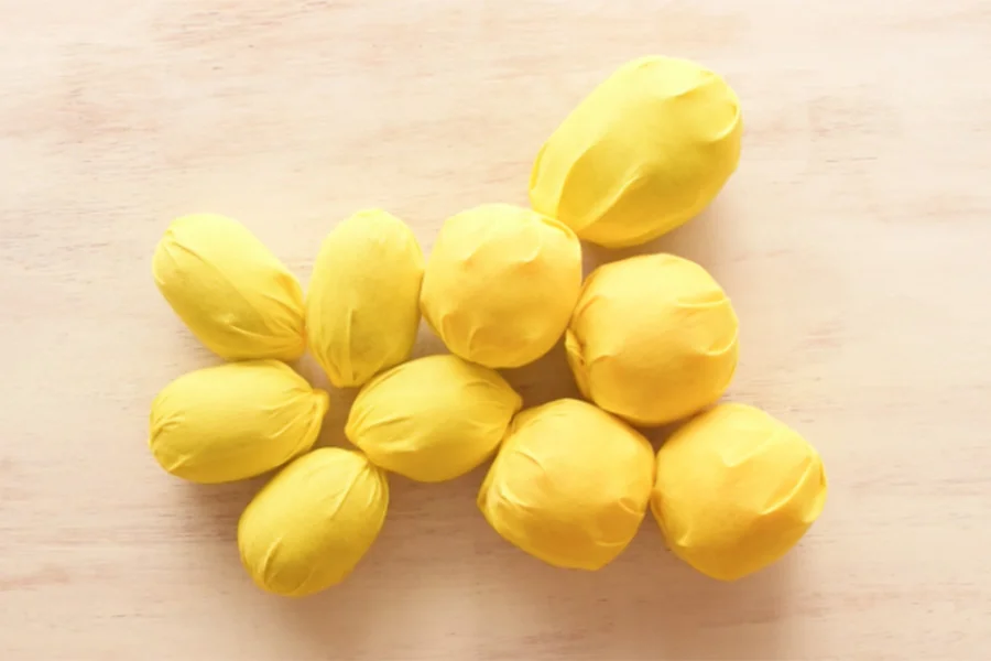 Wrap all your fruits with yellow paper.