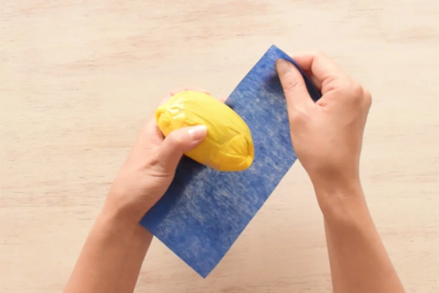 Step 1: Cut your blue paper to the size you can wrap the bottom half of your fruits.