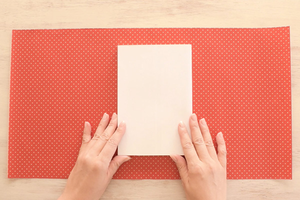 Step 1: Cut your paper to: (width) enough to wrap around the book + width of the book + extra to create a fold. (height) height of the book + extra on top and bottom
