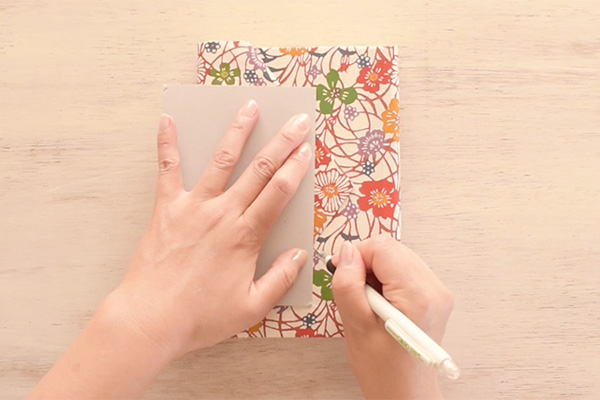 Step 16: Draw two lines for the slits to put through the envelope tip.