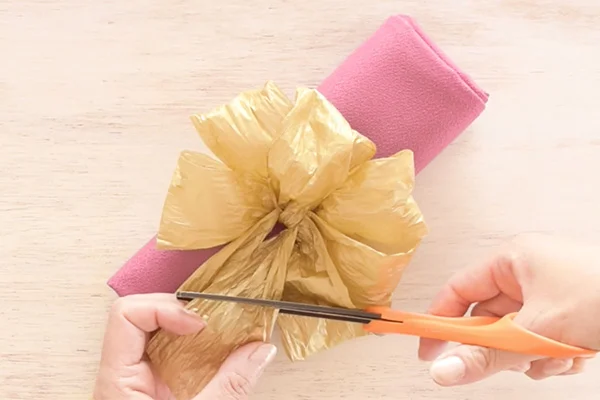 Step 10: Pop-up the loops and shape the bow. Cut the ends at the desired length.