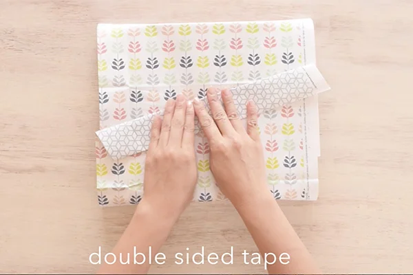 Step 7: Close the end making sure the paper is wrapped around the box tightly.