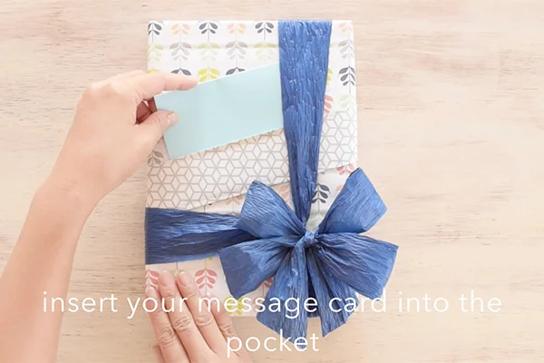 Step 16: Write your message on the cardstock, then insert it into the front pocket.