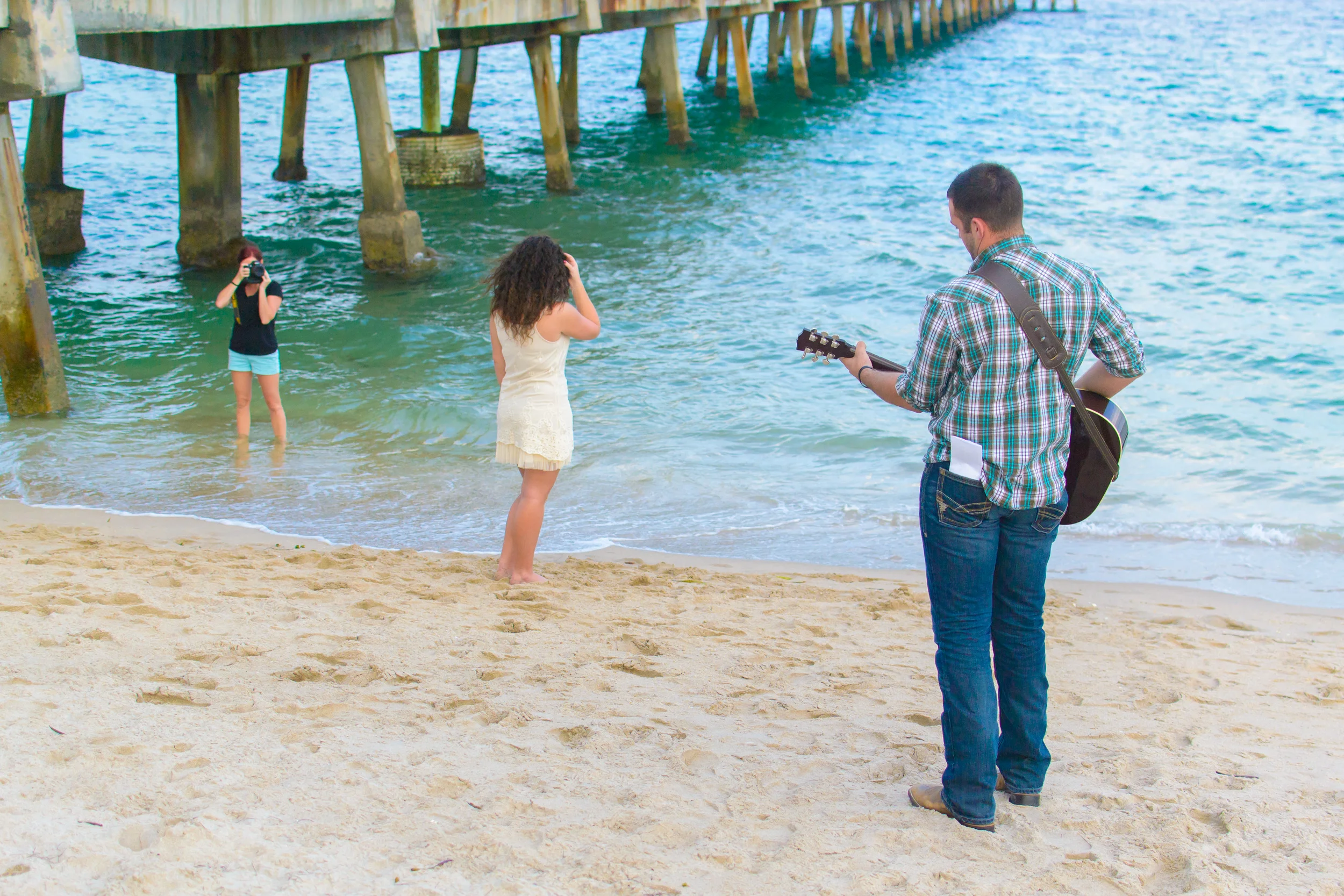This is it! He sneaks up behind her during her individual pose, waiting for the cue from me. Her family standing pier side, camera phones anxiously in hand! (My cameo!)