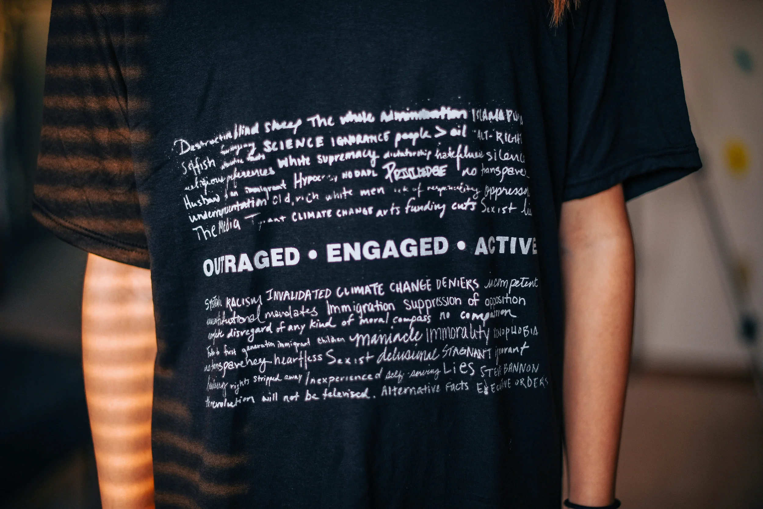 OUTRAGED, ENGAGED, ACTIVE ( quotes ) I encouraged my friends to participate in a project where I asked them to write a few words/reasons why they are outraged in this current political climate. The different handwritten responses are representative of the concerns shared by countless individuals. 