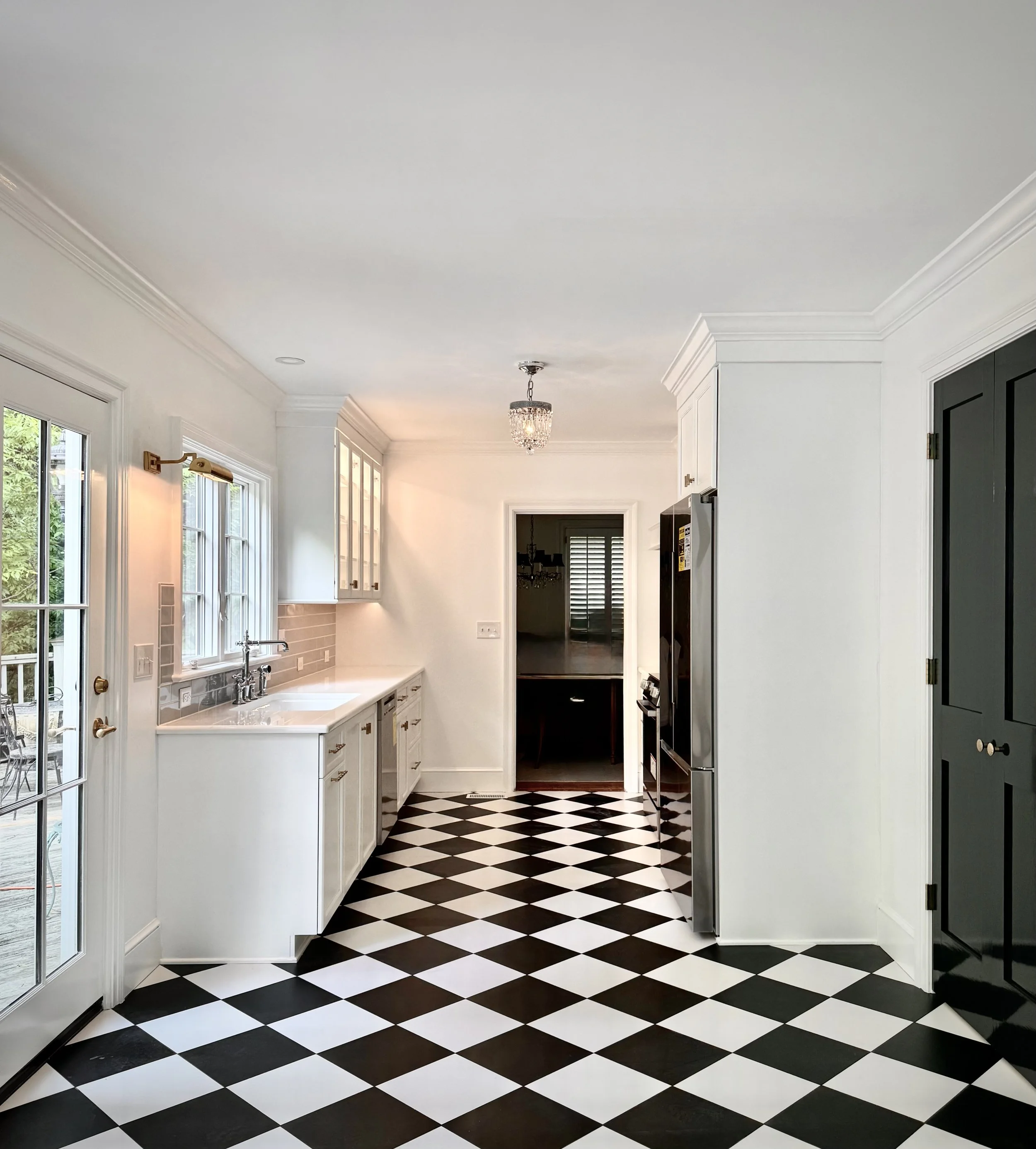Buena Vista kitchen remodel in Winston Salem, NC featuring custom cabinetry by Designing Kitchens and Baths and black and white tile from McCullough Tile.