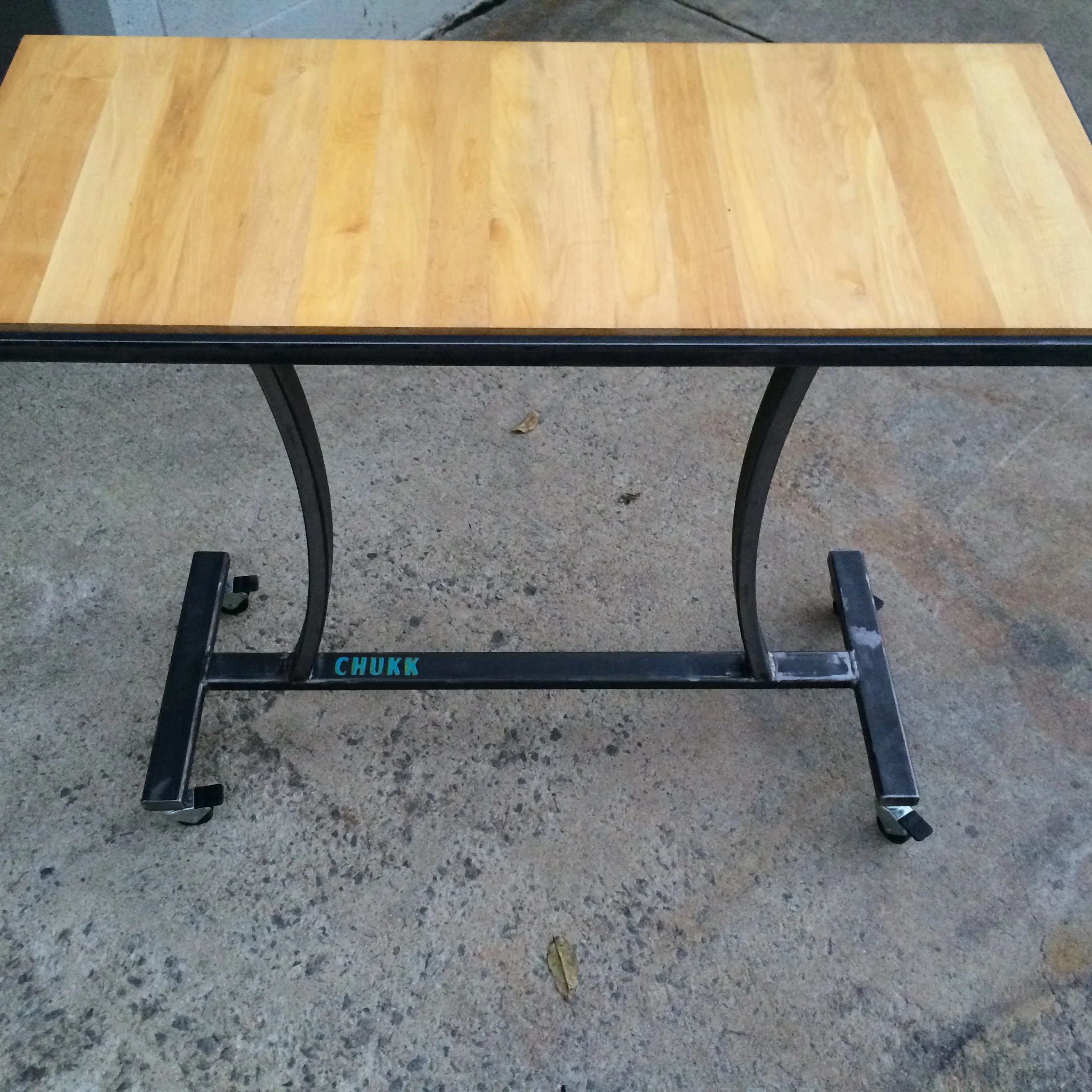 Steel roll about table