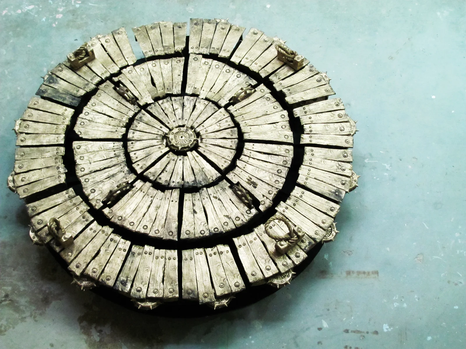   Cannon.  Unfired Clay, paint. Diameter:72in. 2010. For private or public commission, contact artist for design   