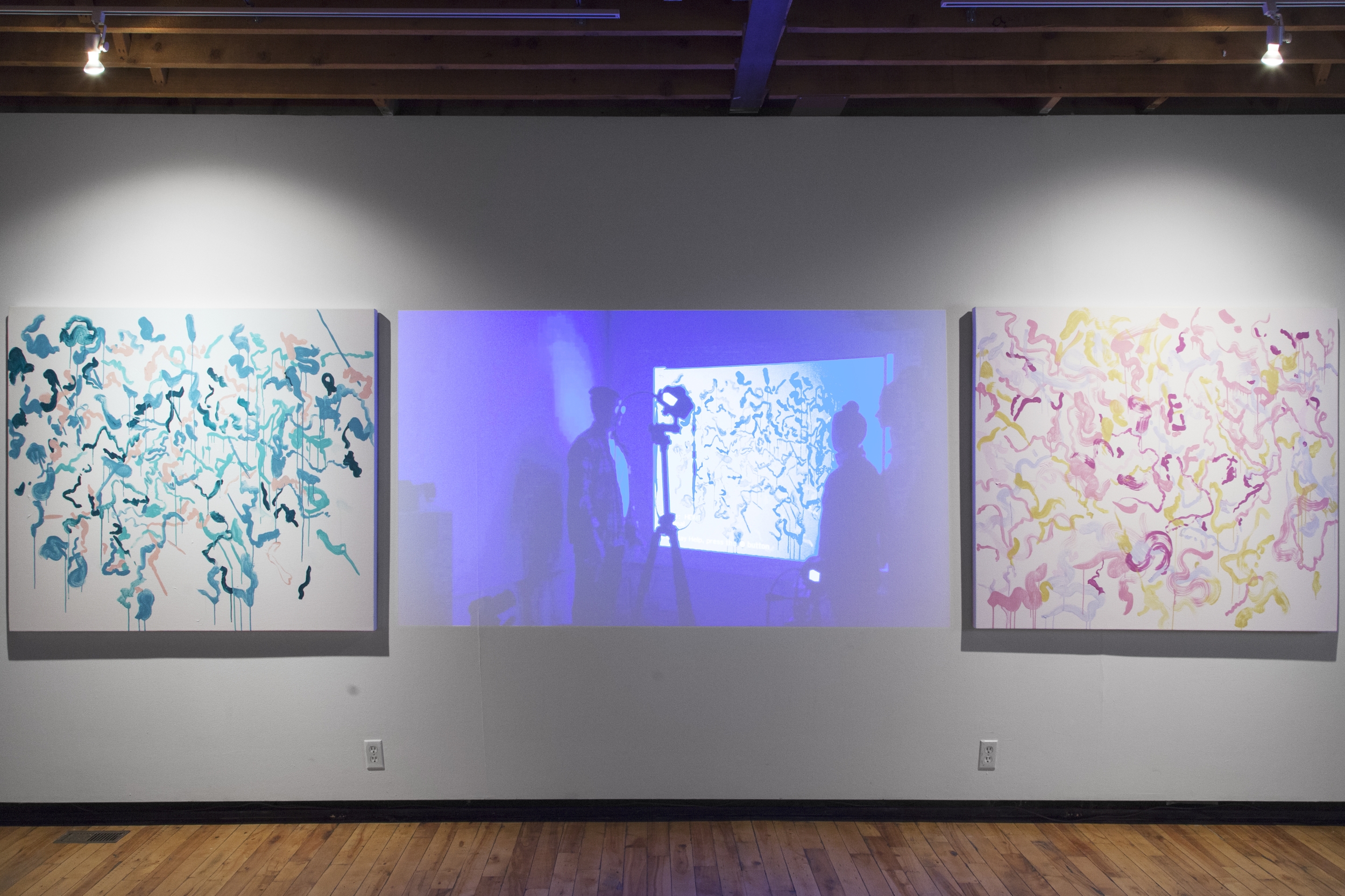 Hudspith and Zirk set up a video-feedback loop using a projector and digital cameras. As the video cameras record what is before them, the live image is repeated on top of the same space creating a loop. A fraction of a second passes for the loop to come full circle, but within the continuing system marks and movements made create visual feedback stretching on ad infinitum. After applying an initial stroke of paint, the artists need only follow the pattern created by the feedback system to generate the work. Using a multi-camera setup on a timed remote controller, the live projection shifts between perspective points every 60 seconds, producing a new pattern to be inscribed. The artists mixed paint to match combinations produced using colour-suggestion software, which isolates simple colour combinations from any digital image, such as contemporary artworks, classical genre scenes, Instagram food selfies, or in this instance, Pantone’s Color of the Year for 2013 and 2014, Emerald, and Radiant Orchid. The Pantone Color of the Year is selected far in advance at secret meetings between various nations’ colour standards groups and Pantone executive, and is used as a marketing tool to ‘forecast’ and implement fashion and design trends globally. Both the self-proclaimed authority and arbitrariness of Pantone Colour Matching System and their Color of the Year selection processes lends itself to the nature of the work where sources external to the artists play a key role in the creation of the paintings. Each step in the process moves the artists further from traditional notions of creative genius. While the artists have been relegated to cogs in the machine, their interaction creates its own art, a dance, mediated by the feedback mechanics. 