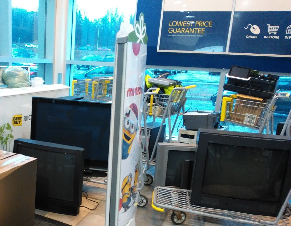 Old electronics dropped off by Best Buy customers await recycling. December 2015.