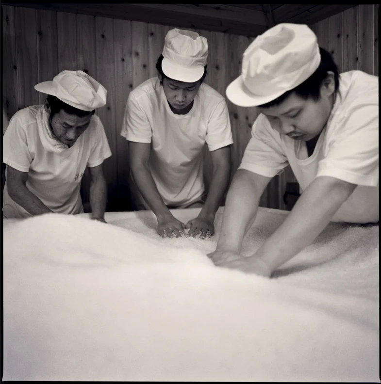 Workers kneading Koji rice.