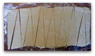 After cutting into equal rectangles, cut each rectangle into two triangles.
