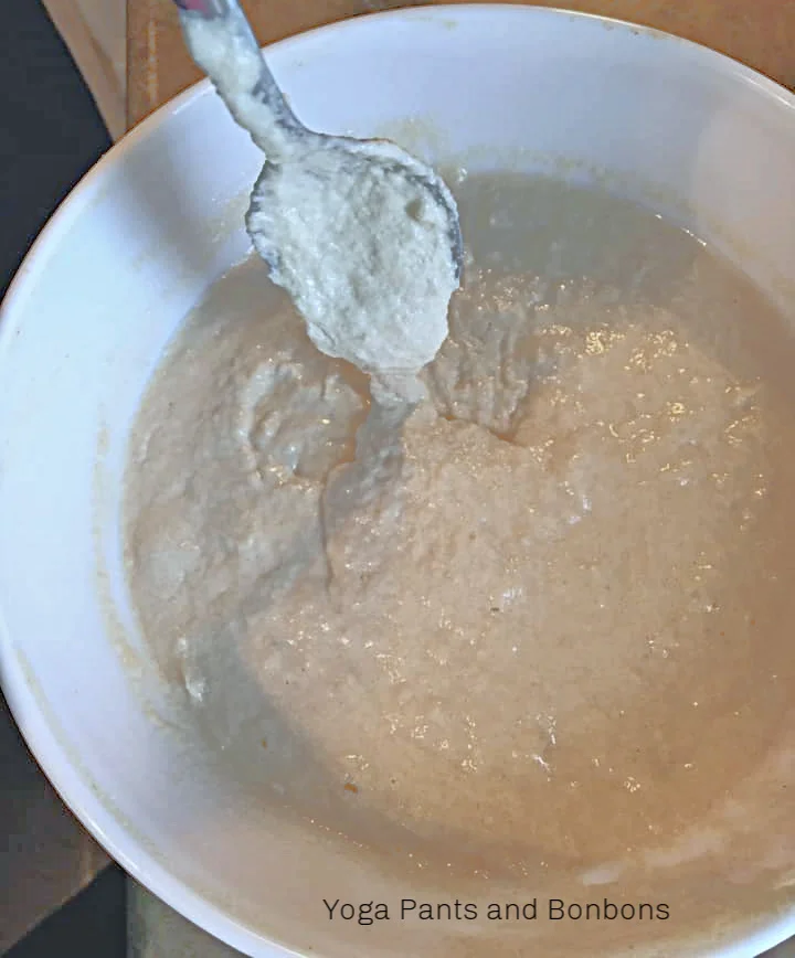Batter needs to be a little thicker than cake batter. You should be able pour it from the bowl into the bread pan.