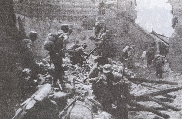  Chinese soldiers fight house to house in the battle of Taierzhuang, via Wikimedia Commons.					  					  					  					  					 