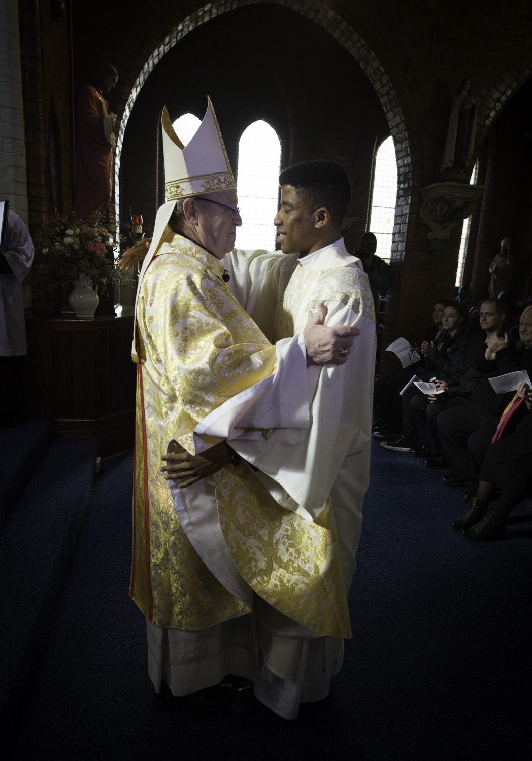 Fidelis and bishop embrace 5.jpg