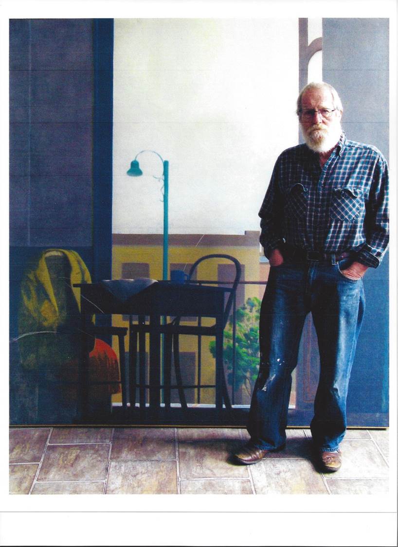 James Hennessey standing in front of a painting in his studio. Title: Lima