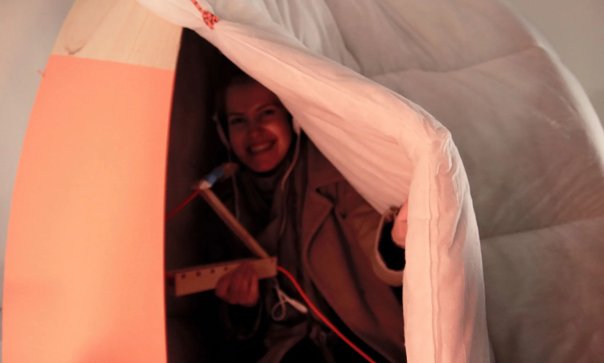 A guest trying the taste of music in our cocoon with sound-isolating headphones for an immersive experience