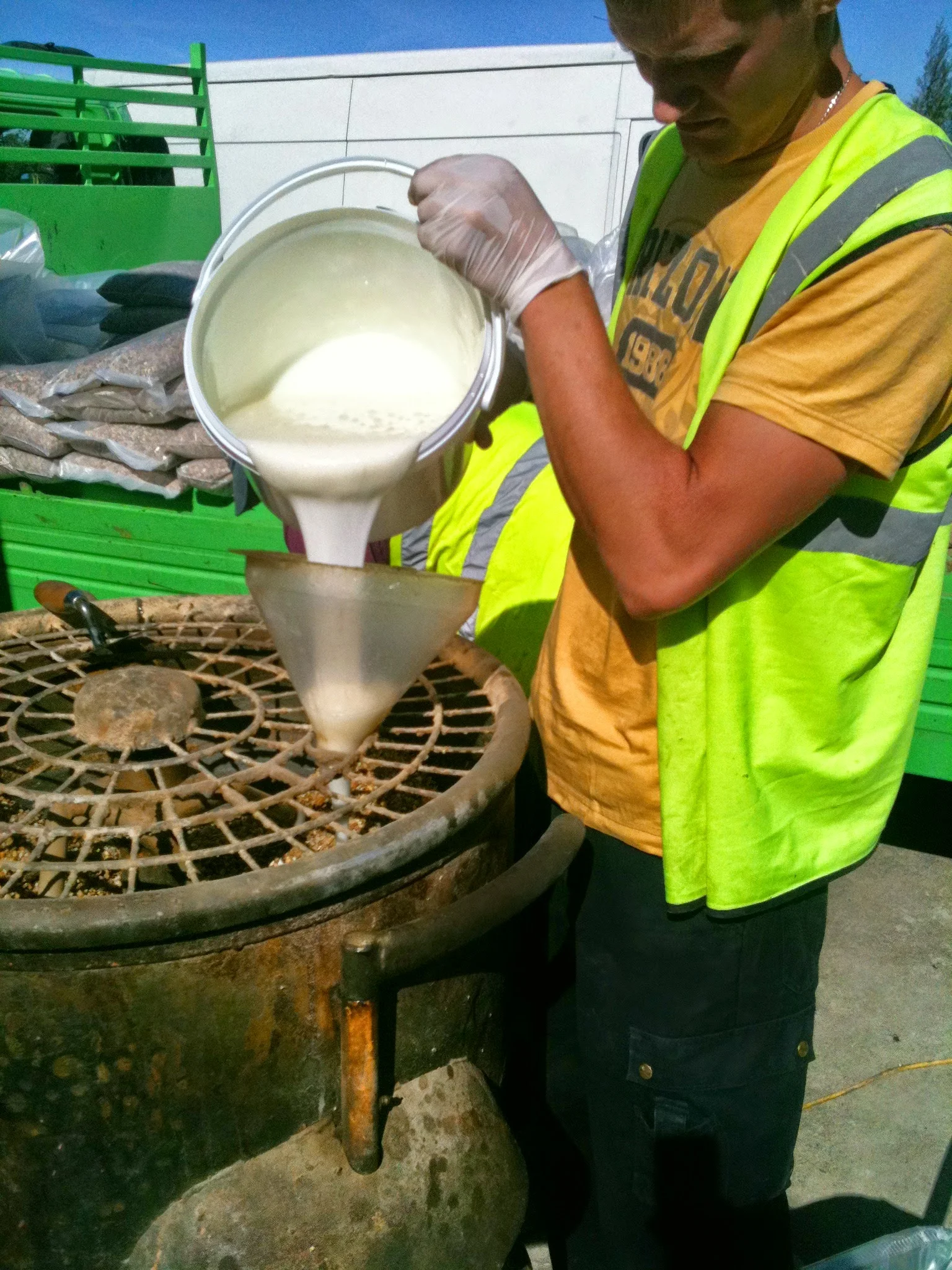 mixing the hard pack for resin bonded surface.JPG