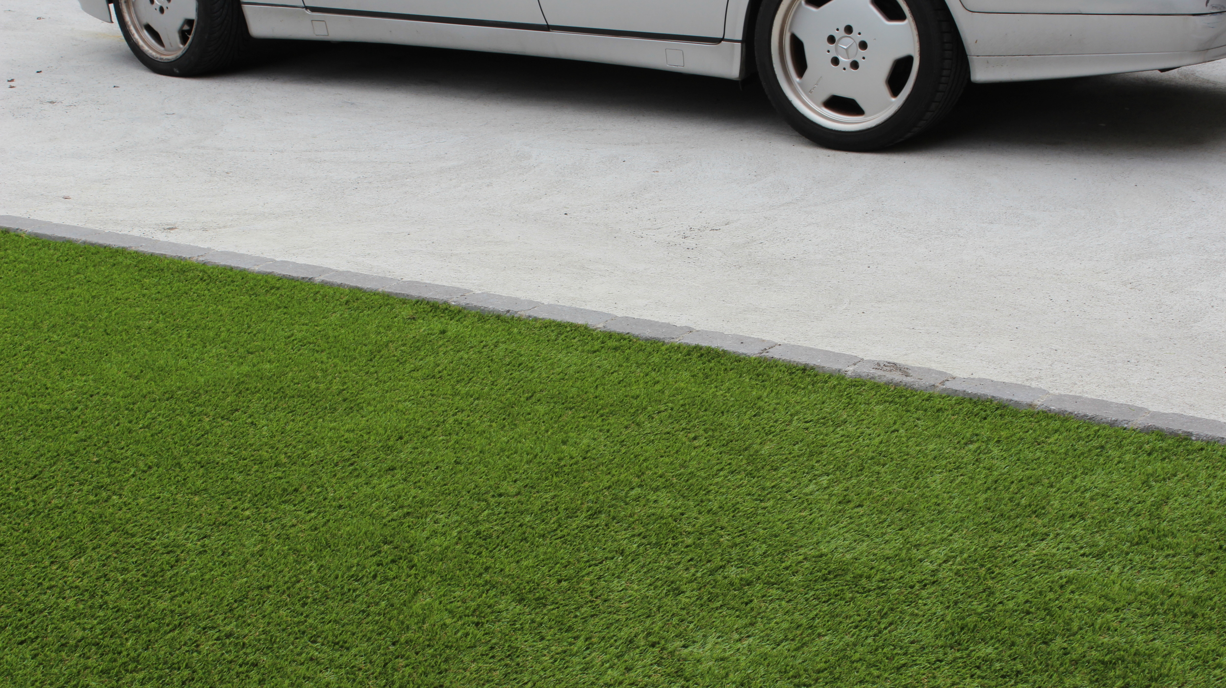 artificial grass and car