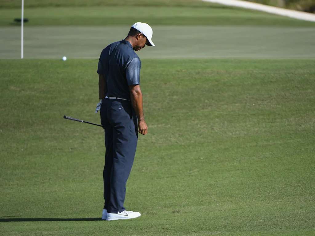 Many viewers of Tiger’s return (including his former coach, Hank Haney ) observed his difficulty with a few “sticky” chips around the greens at the 2017 Hero World Challenge — it should be noted that other players did also have a similar problem dealing with the tight lies around the Albany greens, most notably Hideki Matsuyama. But Woods, who has had more consistent issues in the last few years, stubbed the ground behind the golf ball on a number of shots this week, and half-skulled a few others while trying to avoid the same result. We can pass it off as “rust,” but we have seen it from him before. So let’s talk about it for a bit. The “yips,” as they are known, are one of the most frustrating problems that plague golfers, particularly professional golfers. The physical causes of the yips are well known; this is not some esoteric information known only to great players and coaches. We all know the physical reasons, but the yips are not simply a physical problem. In fact, the physical might be a small part of the problem. The biggest part is the mental. Everyone reading this has yipped a chip , and we all know that the very next time that shot presents itself we are thinking about the yip. It’s difficult (if not impossible) to dismiss that last shot from the mind. And if it happens more than once, or more than few times, it might be permanently on one’s mind. That’s a huge problem if you play the game for a living. Brandel Chamblee, with whom I have publicly disagreed in the past, has a theory on this. He believes no great player has ever really gotten over the condition. I can’t say if that’s true or not, but it may be. It’s been said, (I have read that Sam Snead might have said it first, but who knows where these things ever really come from) about the yips: “Once you’ve had ’em, you’ve got ’em.” How’s that for a scary thought? Who knows if it’s true, but one thing I do know is this; golf always seems to go for the jugular! It seems as though every time I have ever stubbed a chip shot, very soon, if not the very next hole, I have to hit another chip from a tight lie. If I’ve just missed a short putt, very soon, if not the next hole, it also seems like I’ll knock it 5 feet past the hole. And what am I thinking about? You guessed it, the last missed short putt. So no amount of mental discipline seems to overcome these evil thoughts. Hitting the ground behind the ball on a short shot is caused by one or any combinations of the following: The leading edge of the wedge sticking in the ground An early release with a closing face Swaying off the ball A path that is too inside-out (too far from the inside) But as I noted, every tour player and coach KNOWS this all too well. The same player who once chipped in from behind the 16th green at Augusta with a Green Jacket on the line yipped some sticky chips last week. To me, that is not rust or a mechanical problem; it’s a mental one. I would like some professional psychologist or mind-discipline expert to chime in to advise all of us on how to overcome this problem. It’s easy enough to say: “Forget about it, stay present, play the shot at hand only.” But that seems almost impossible, or at the very least, difficult to do. “Don’t think about yipping this shot” is almost a sure fire way to do just that. It’s a vicious cycle. If it’s on Tiger’s mind, the rest of us are in big trouble. Let’s hope Chamblee is wrong, but I have to wonder. Remember the down time in golf far exceeds any other game. We are on the golf course 4+ hours, and in the act of swinging a club a total of only about two minutes. The rest of the time is thinking about swinging the club, and the outcomes. And unfortunately what we usually think about is the WORST shot we have hit in a situation, not the best. And when that shot is a short, chip from a tight-lie, well, that’s when the yips resurface. The mechanical is correctable, but the mental is long-lasting. By Dennis Clark 