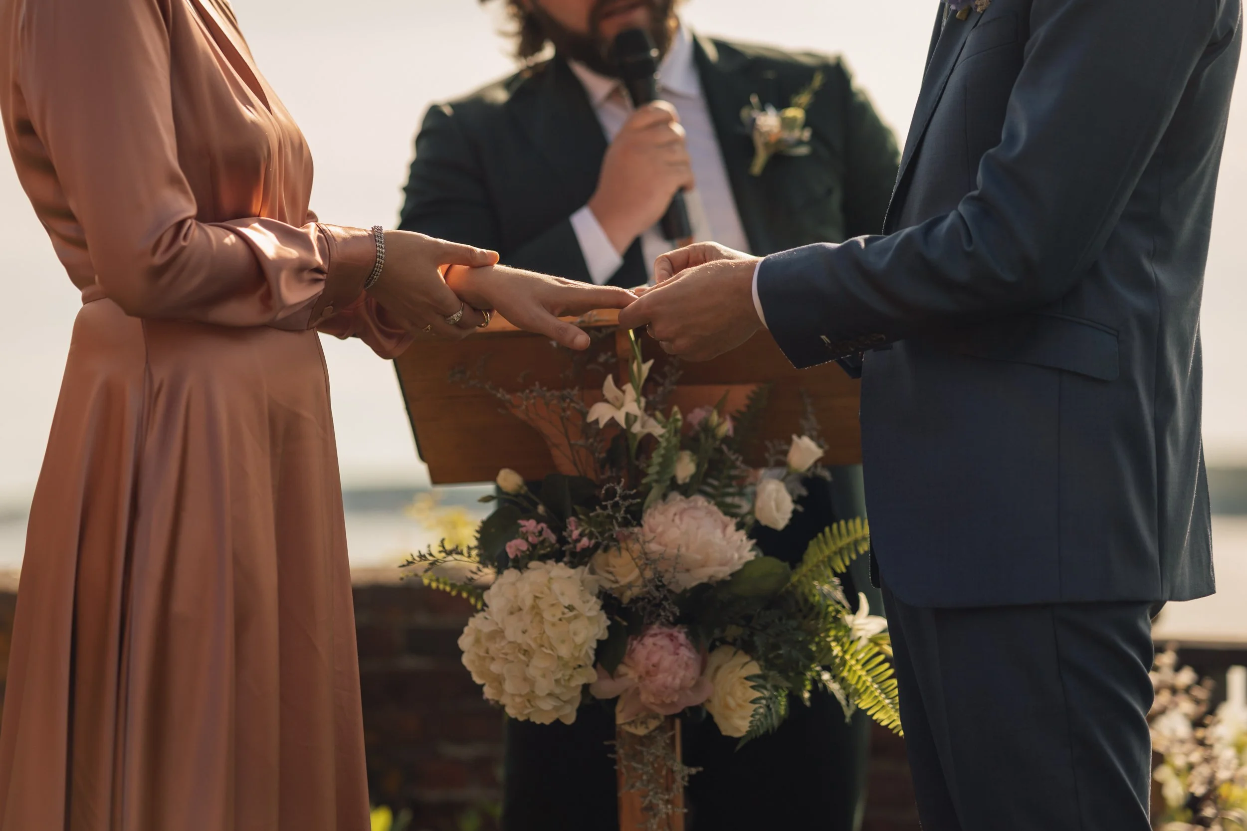 Documentary wedding photographer best in America captures ring exchange at Beauport, the Sleeper-McCann House.
