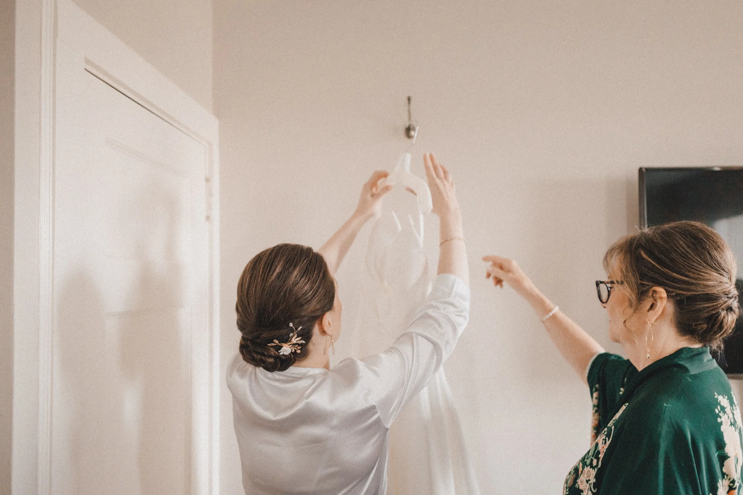 Bride hanging up her dress at Peabody Essex Museum wedding