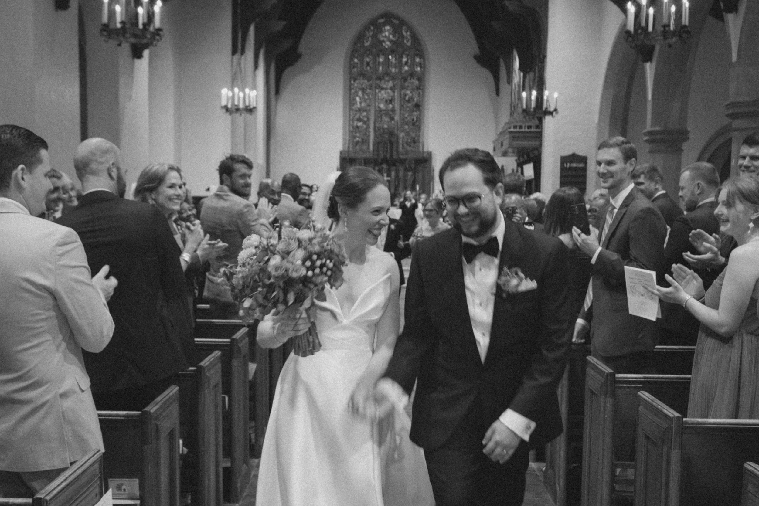 Bride and groom walking up the aisle at Peabody Essex Museum wedding.