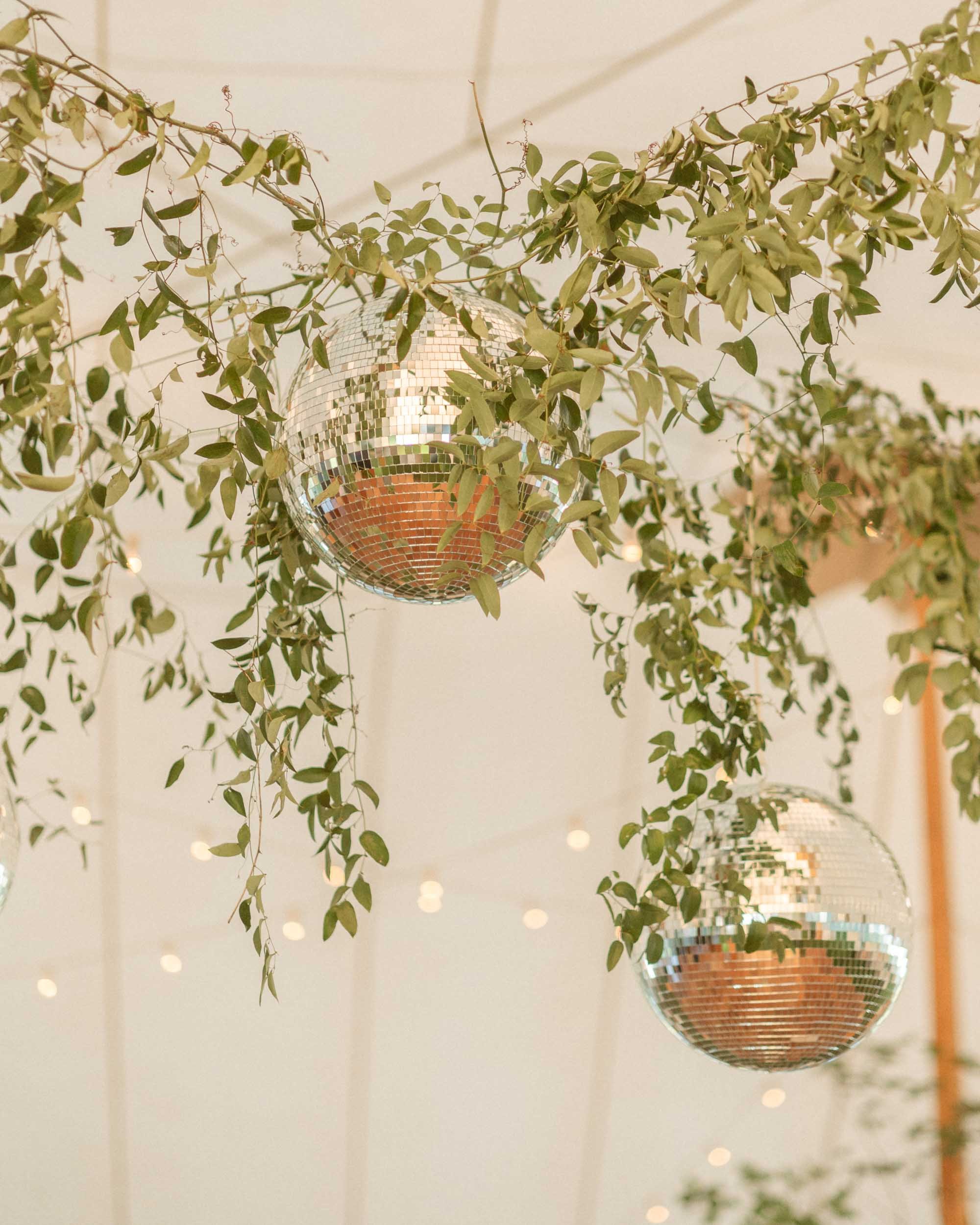 Disco ball hanging in a sperry tent at a wedding reception in Sarasota Florida.