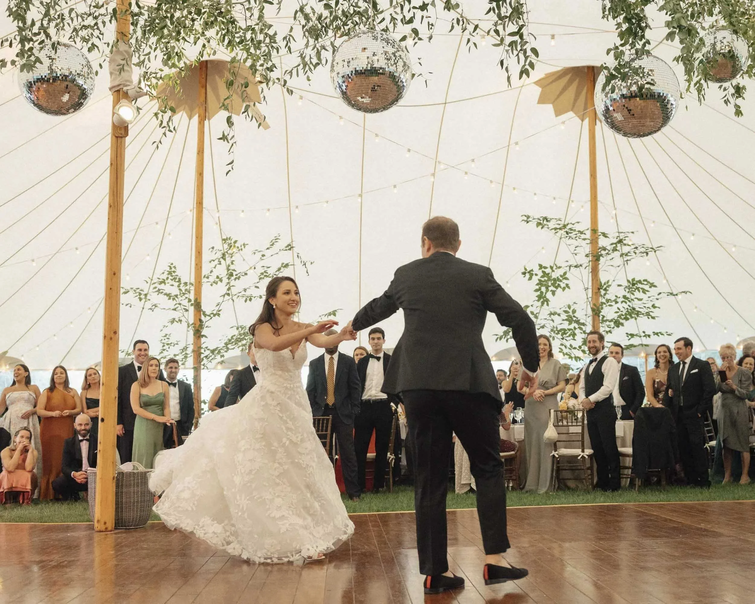 First dance under sailcloth tent — Sarasota wedding photographer and videographer
