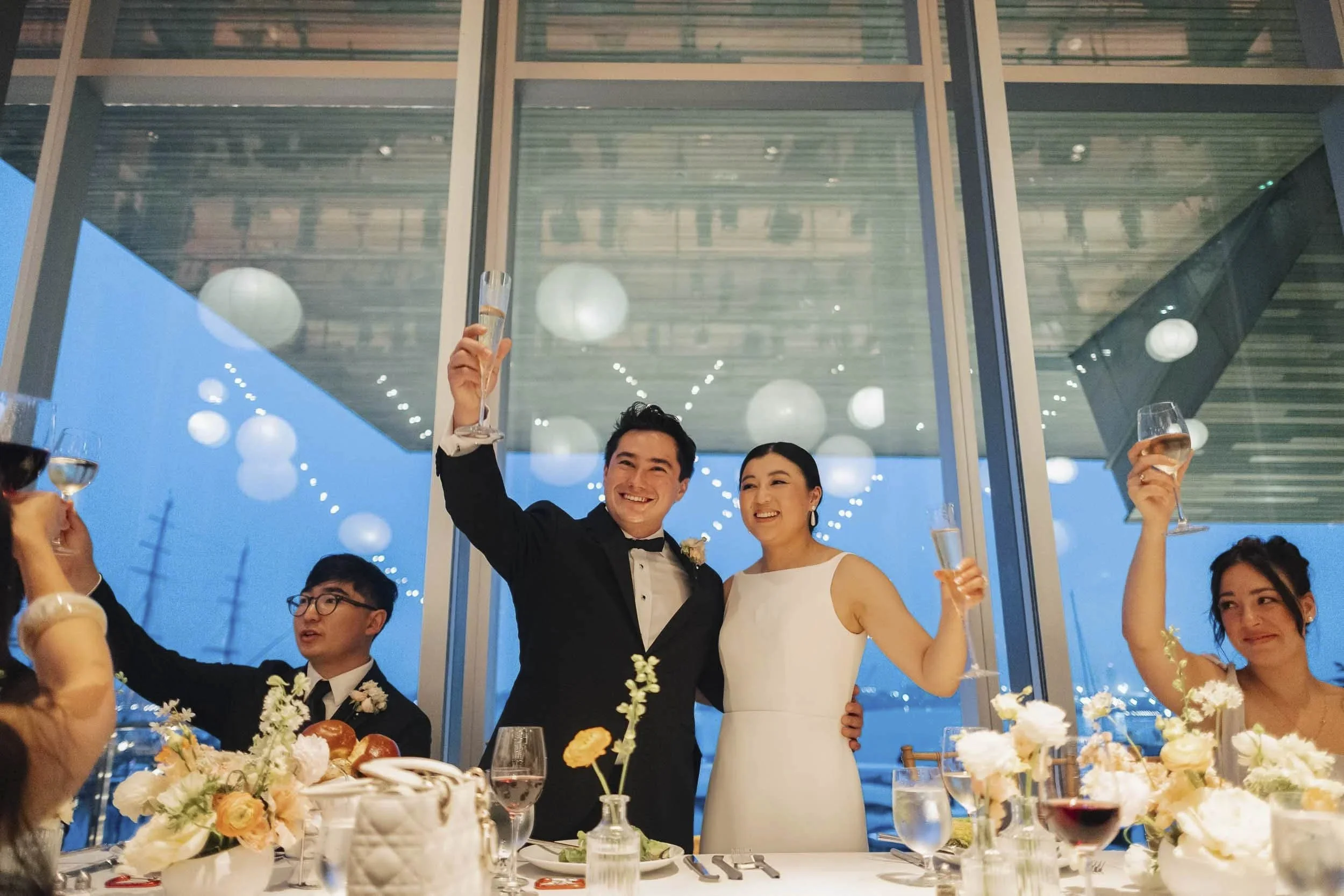 Couple champagne toast at Sarasota wedding reception — documentary wedding photography