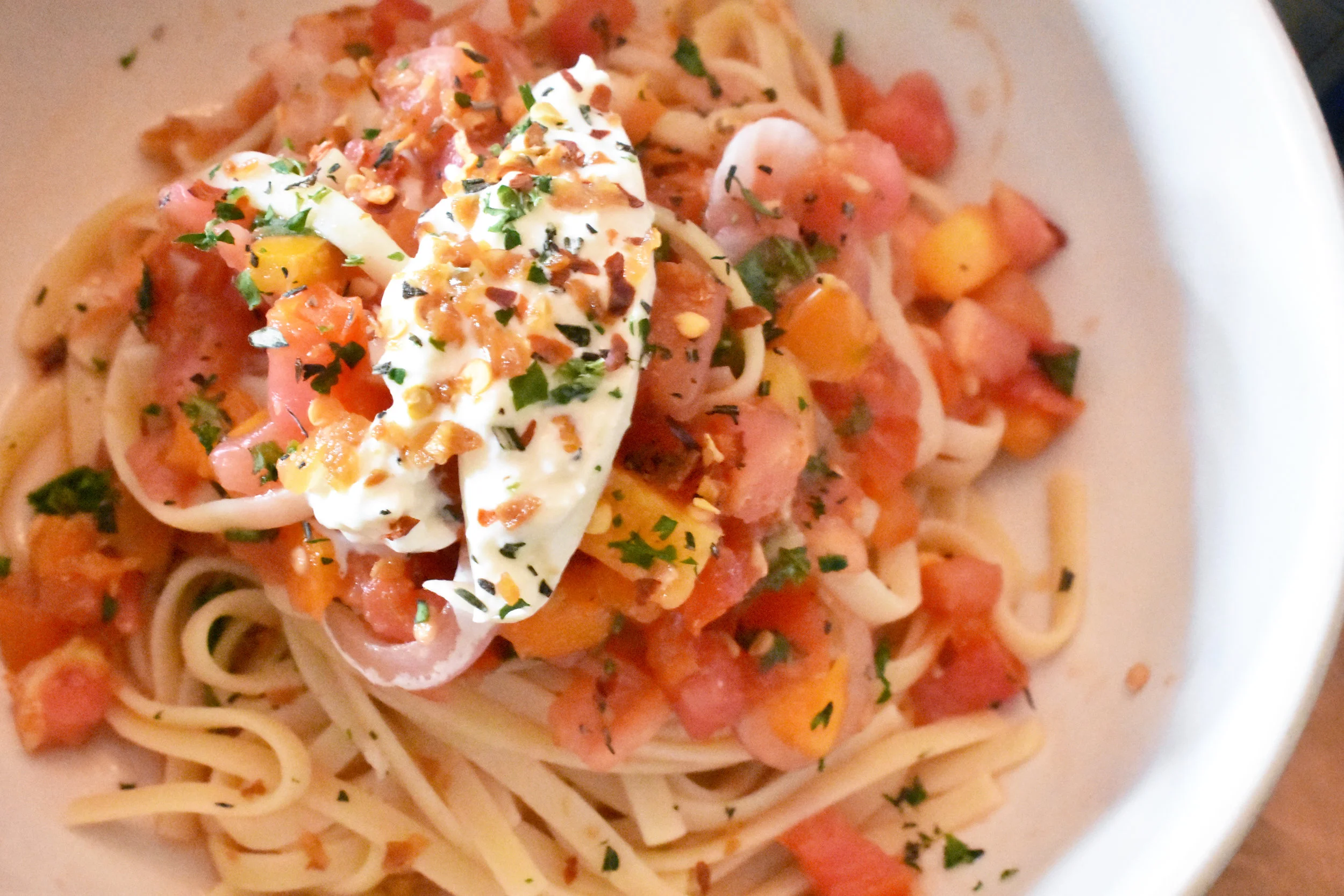 Delicious Pasta alla Checca (gluten free and vegan options available) at Hillside Farmacy in Austin, TX