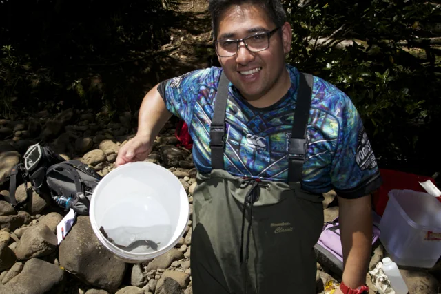 Tangaroa with small tuna in white bucket.jpg