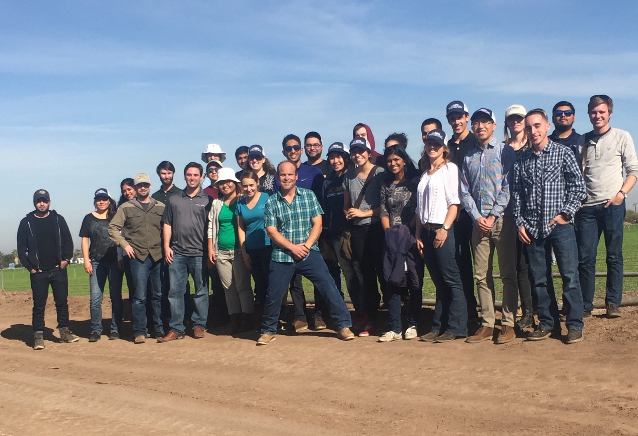 Group photo with Jack near a cilantro field.