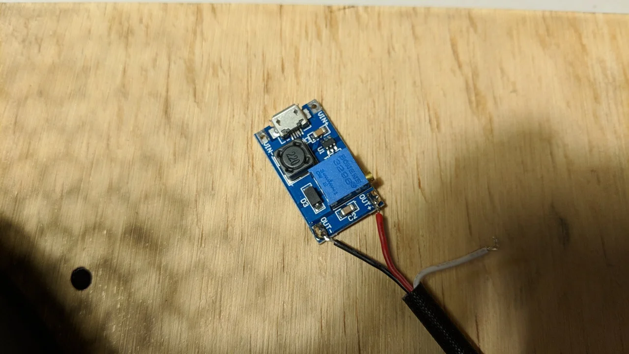 DC-DC voltage booster with a micro usb power input